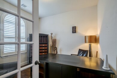Private office space off entry with closet could be used as a fifth bedroom.