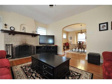Living Room. Original mantle and fireplace, access