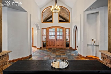 Grand foyer entrance with an inviting chandelier a