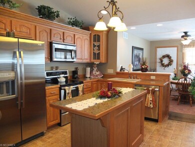 Open kitchen with vaulted ceiling, stainless steel
