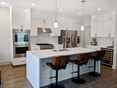 Kitchen featuring appliances with stainless steel