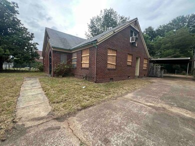 View of property exterior featuring a yard and a c