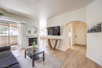 Living area with baseboards, light wood-type floor