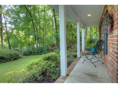 Front country porch overlooks the beautiful azalea