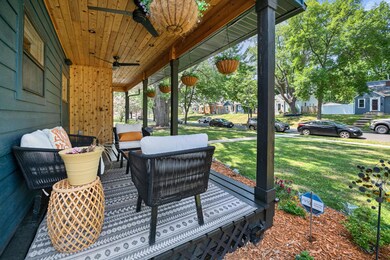 Gorgeous front porch with 2 ceiling fans, speakers, recessed lighting