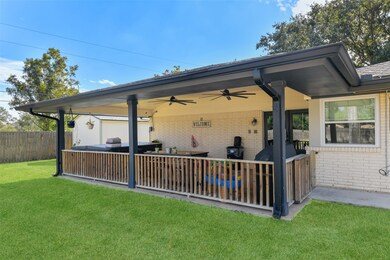 Covered patio with 8 person hottub.