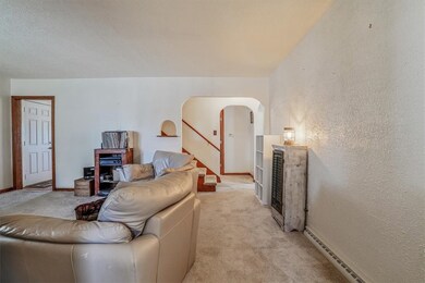 Warm and inviting living room viewed from the entr
