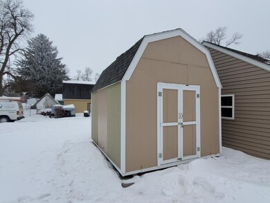 Spacious storage shed with overhead storage