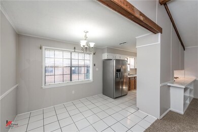 Ceramic tile laid throughout the kitchen and break