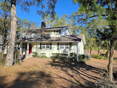 View of front facade featuring cooling unit and a 