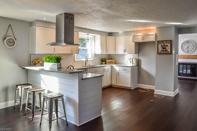 A breakfast bar provides additional seating and counter space.