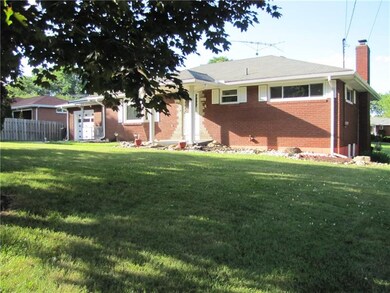 This home sits back from the street and has mature