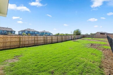 Fenced backyard with a residential view