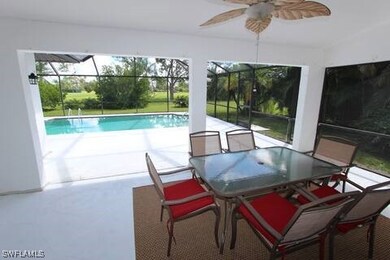 Swimming pool featuring glass enclosure, a patio,