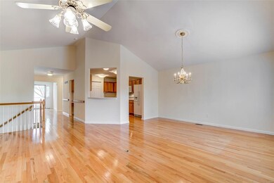 Another view of living/dining room area and kitchen
