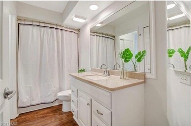 Bathroom with walk in shower, vanity, toilet, and 