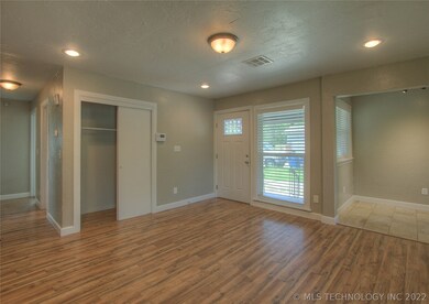 Spacious entry with closet.