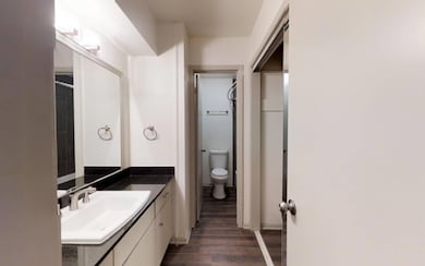 Bathroom featuring hardwood / wood-style floors, v