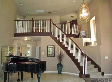 Dramatic curved staircase with display ledges. The