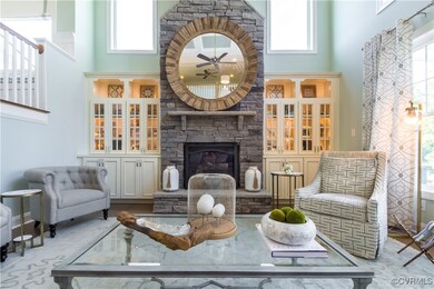 Living room with a fireplace, a healthy amount of