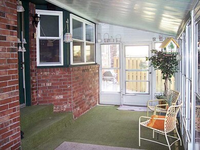 Sun Room. large sunroom features privacy screened