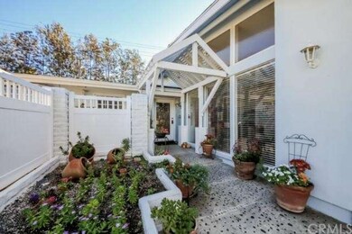 Charming entry and lush gardens