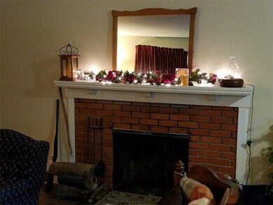 FIREPLACE WITH CERAMIC HEARTH, BRICK FACING AND EL