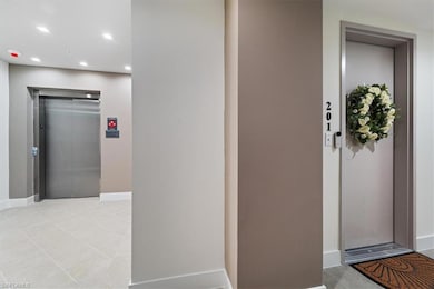 Doorway to property featuring elevator