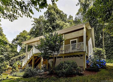 Adorable Cottage with large rocking chair front po