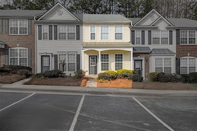 Townhome / multi-family property featuring a stand
