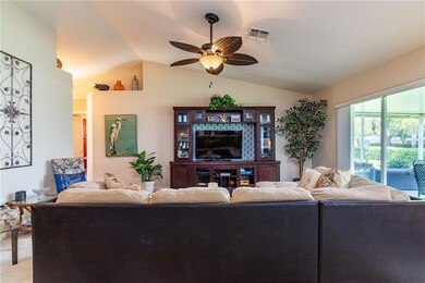 SPACIOUS GREAT ROOM, VAULTED CEILINGS, PLANT/COLLECTIBLE SHELVING.
