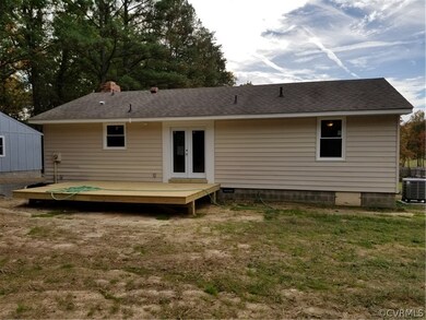 New rear deck on 6 x 6's.  New door and windows!