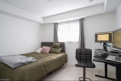 Bedroom with light hardwood / wood-style flooring