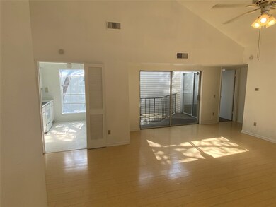 View of living and kitchen from front door. Slidin