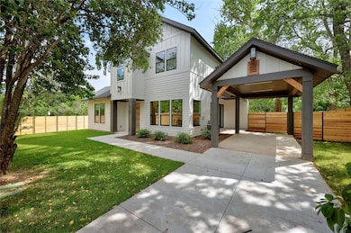 View of front of home with a front lawn, driveway