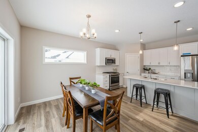 Dining room -  photo is of a previous inventory home. Inquire for more details and options.