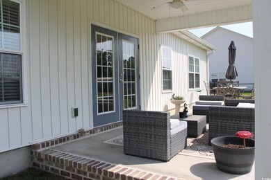 View of patio featuring a ceiling fan and french doors