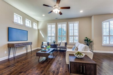 Living room with plenty of natural light, baseboar