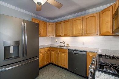 Kitchen has been recently updated with brand new countertops and backsplash, newer stainless steel appliances and gas range.
