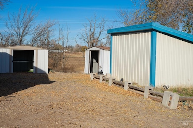 View of property exterior featuring a storage shed
