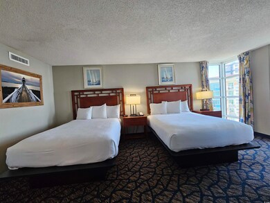 Bedroom featuring a textured ceiling and dark carp