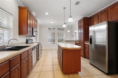 KITCHEN HAS GREAT STORAGE PLUS CENTER ISLAND.  TOW