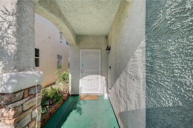 Entrance to property featuring stucco siding