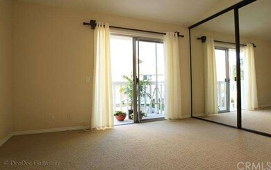 Master Bedroom with Balcony Overlooking Greenbelt 
