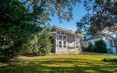 View of property exterior featuring a lawn