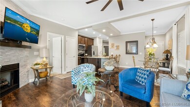 Living Room with Stone accent fireplace