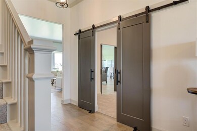 Corridor with light hardwood / wood-style floors