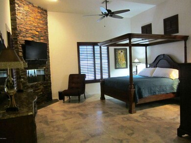 Master Bedroom with Stoned Fireplace