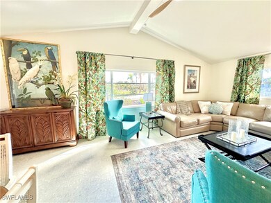Living room featuring lofted ceiling with beams