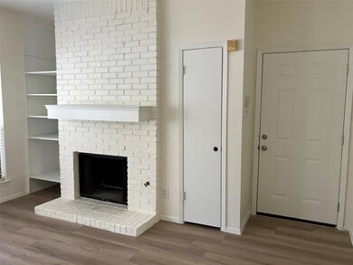 Unfurnished living room with a fireplace and wood finished floors